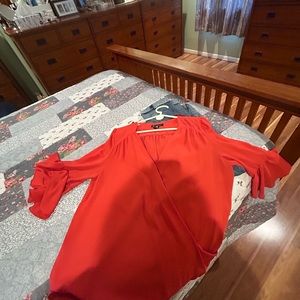 Red silky shirt for casual work or evening out.